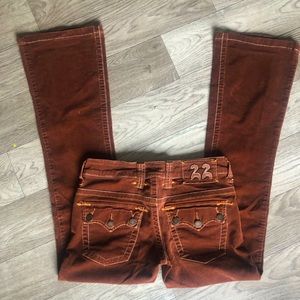 Brown corduroy jeans with buckle pockets